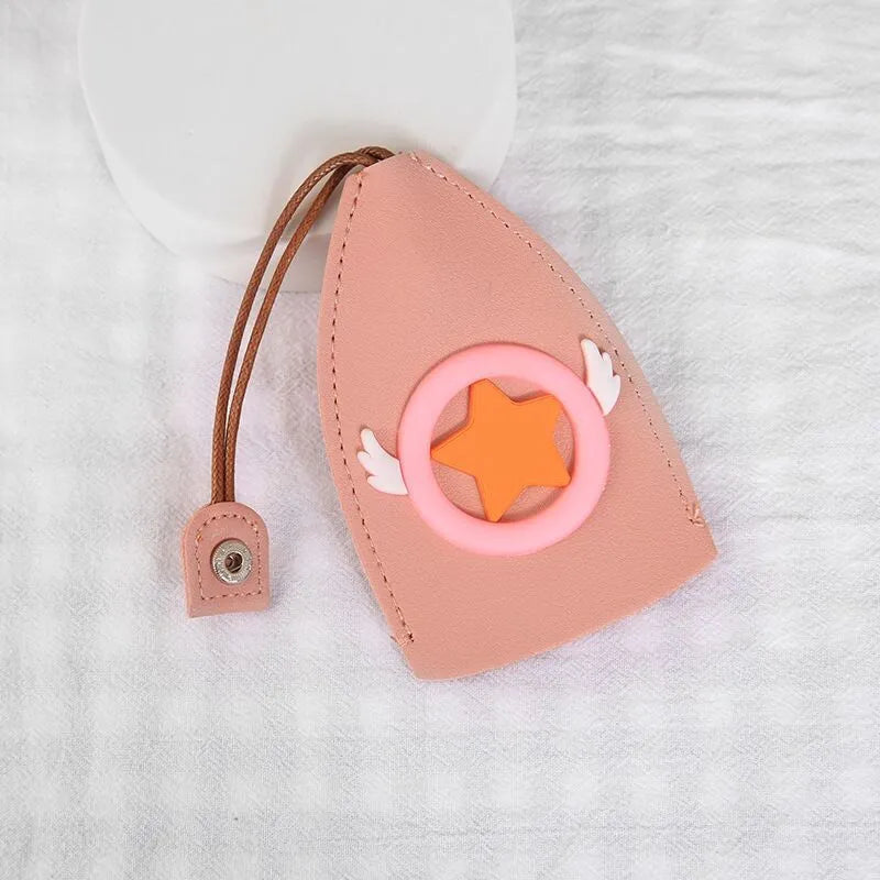 Cartoon-design PU leather pull-out key case for car keys, shown with pull tab extended.