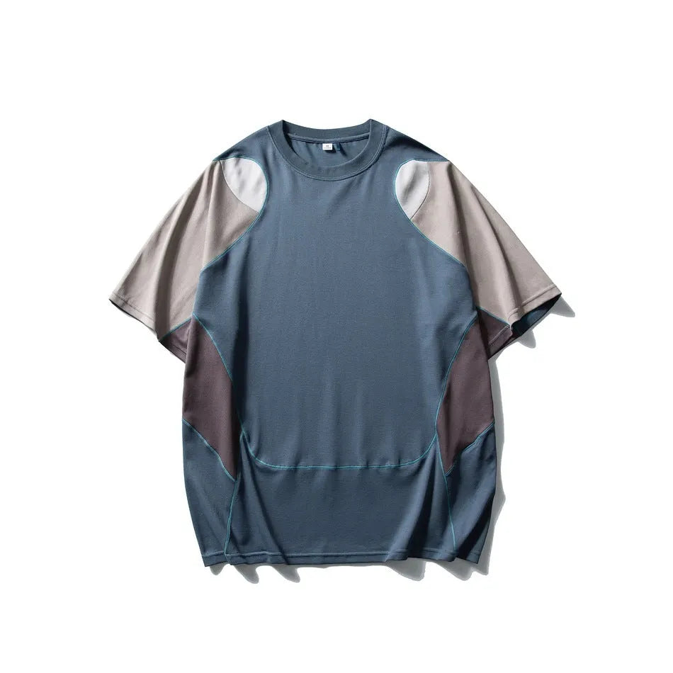 Men's loose blue patchwork t-shirt with contrast colour design and short sleeves.