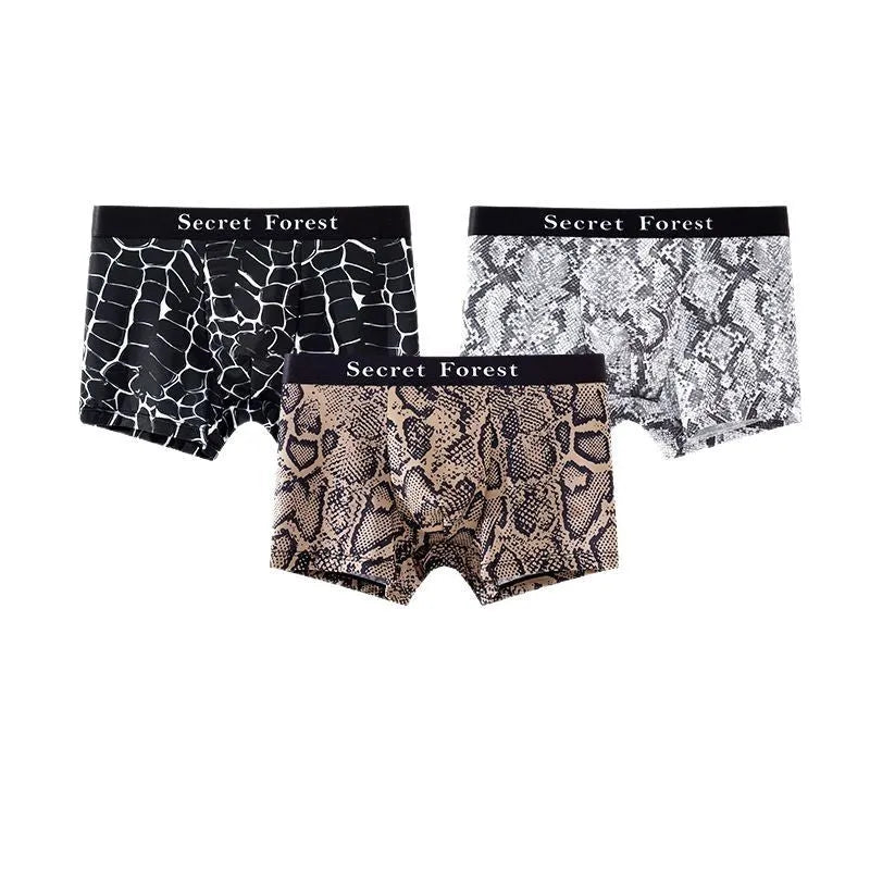 Men's loose fit boxer shorts in thin black polyester fabric laid flat