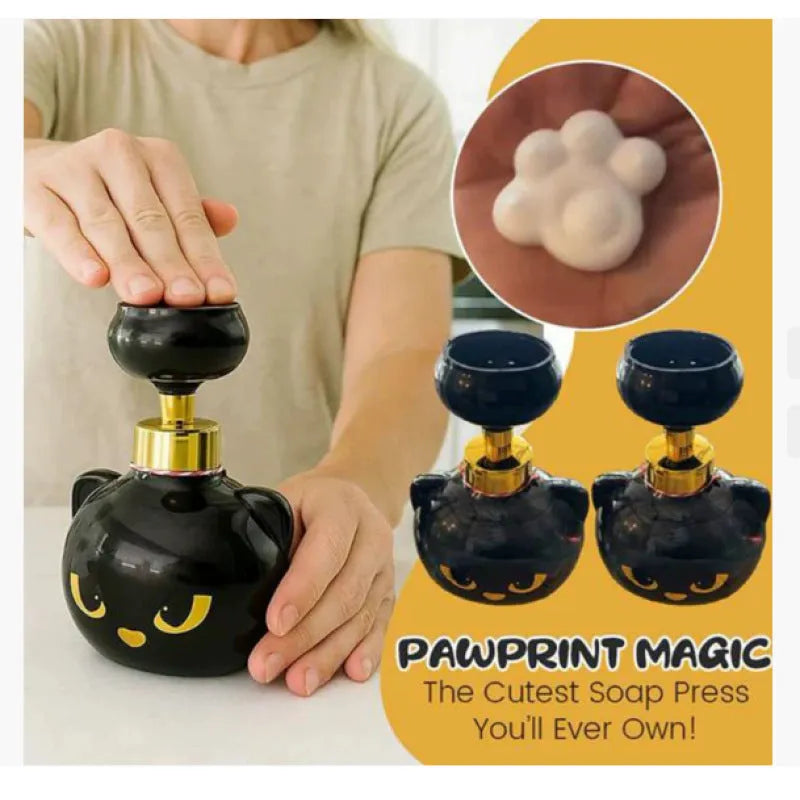 Black cartoon cat shaped manual foam soap dispenser on countertop
