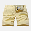 Man wearing blue denim casual shorts with an elastic waistband, showcasing the loose fit and straight leg design.