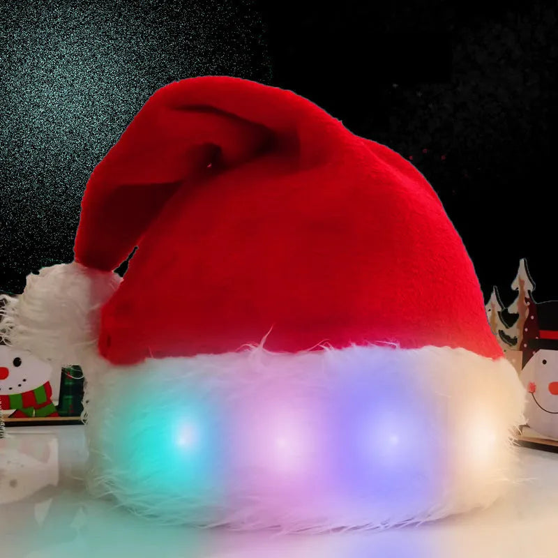 Red and white plush LED Santa hat with pom-pom and multi-colour twinkling lights on model.