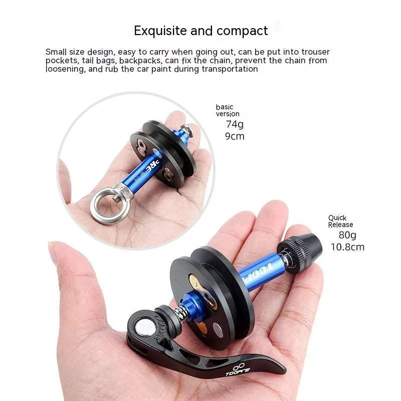 Aluminium bicycle chain holder and tensioner tool for washing, shown in hand.