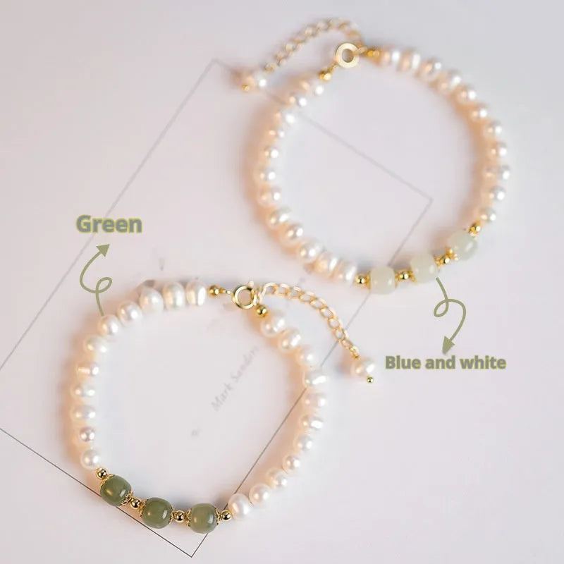 Diamond-shaped freshwater pearl bracelet in electroplated Hetian jade colour on a wrist.