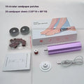 Pink USB-powered electric callus remover tool with sandpaper discs on a table.