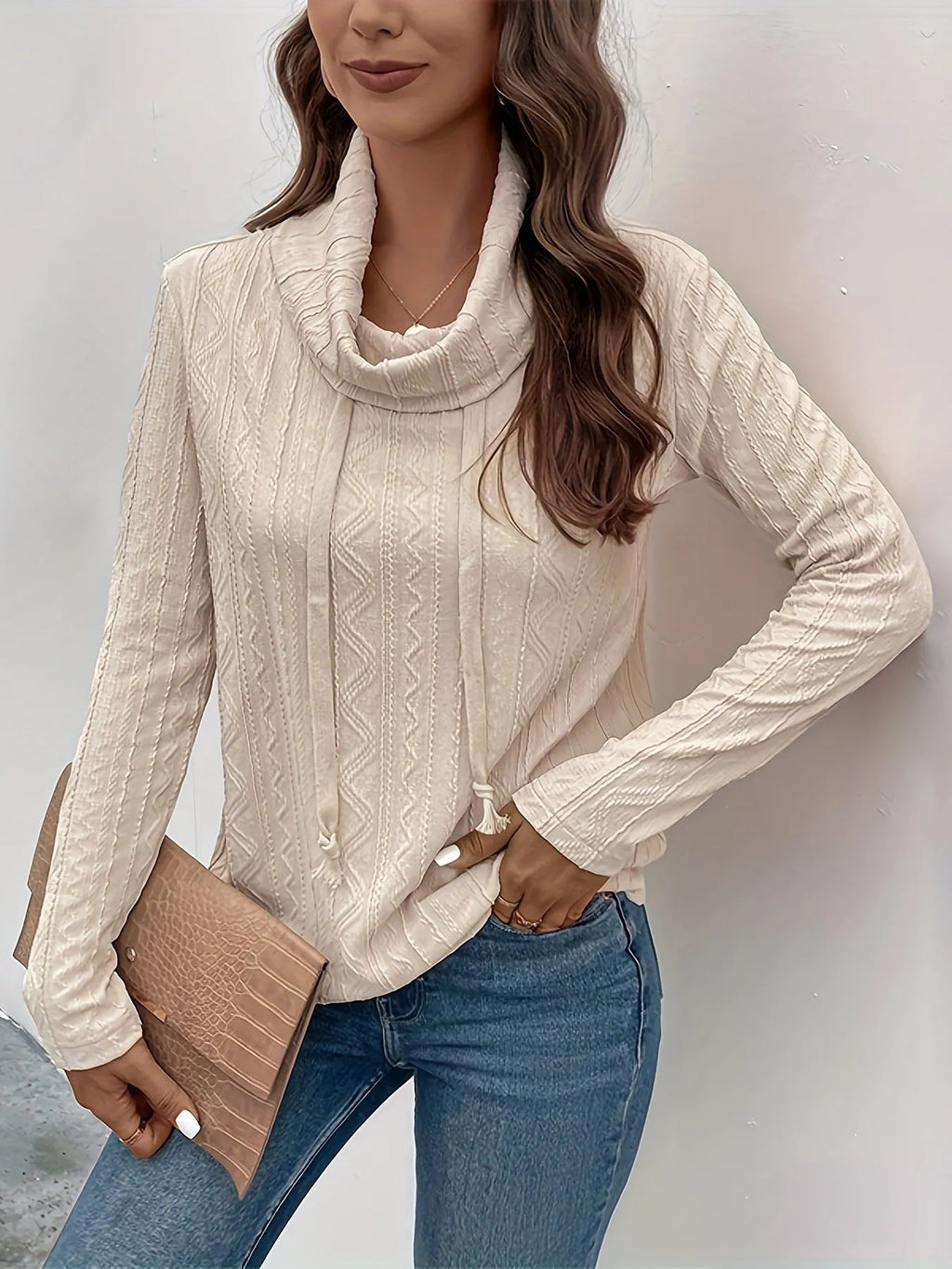 Apricot coloured hooded pullover sweater with long sleeves and drawstring adjustment