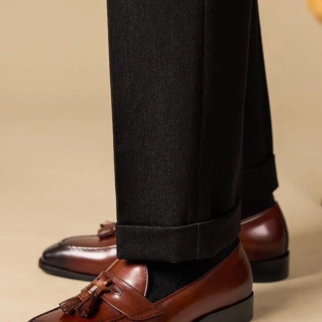 Men's genuine leather tassel loafers in black and brown colours showing polished upper and rubber sole