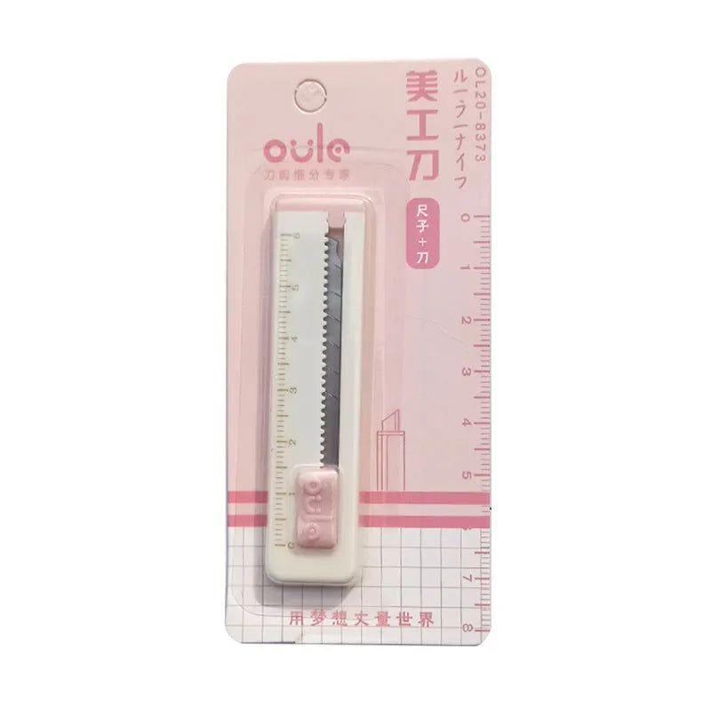 Small plastic-bladed art knife in one of five colours: blue, khaki, orange, pink, or purple.