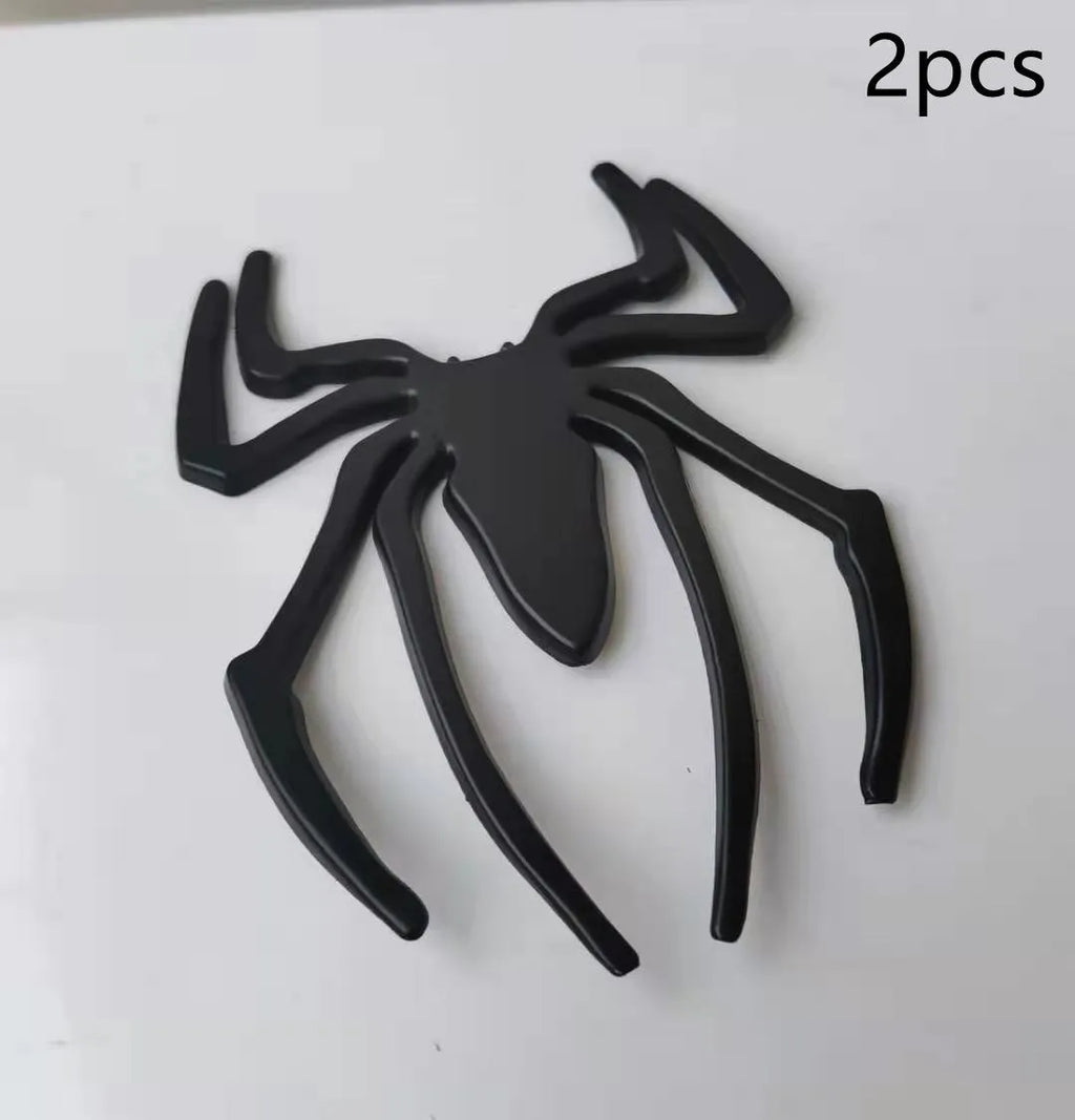 Three-dimensional zinc alloy spider bumper sticker in gold colour measuring 7cm by 5cm