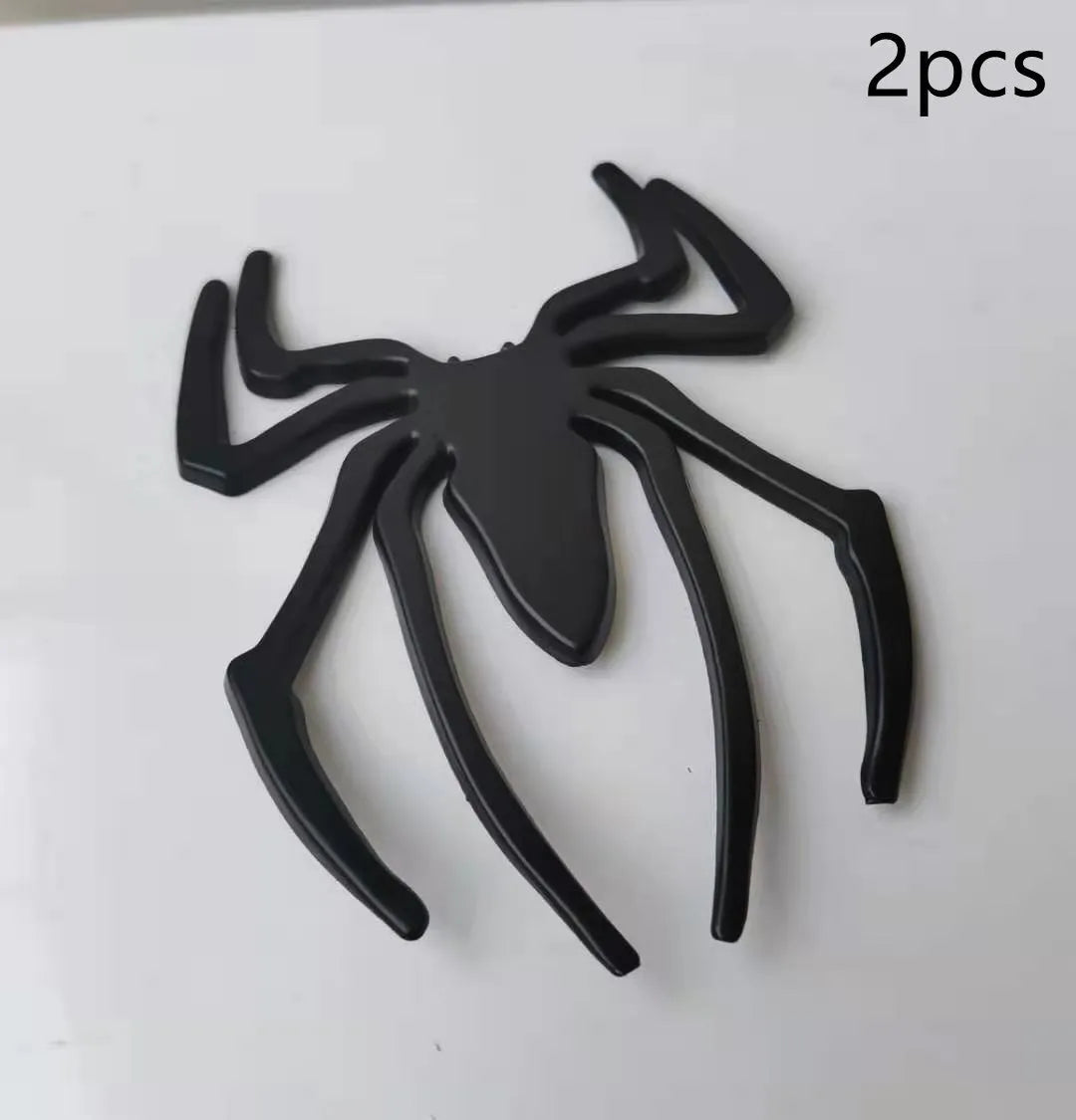 Three-dimensional zinc alloy spider bumper sticker in gold colour measuring 7cm by 5cm