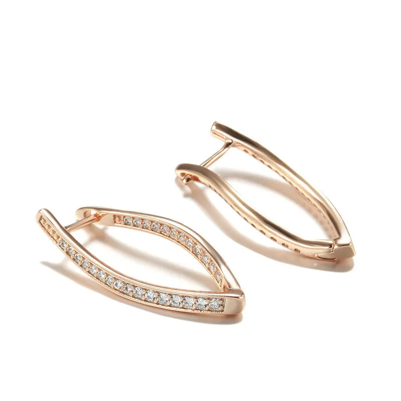 A pair of geometric-shaped copper earrings with zircon detail in H0493 colour, shown from the front.