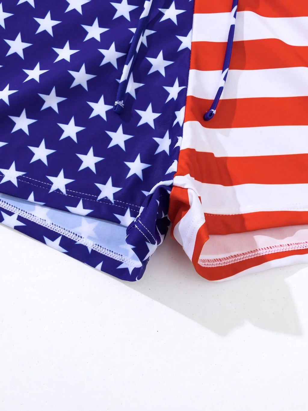 Women's high waist swimsuit briefs in a Stars and Stripes pattern with a drawstring waistband.