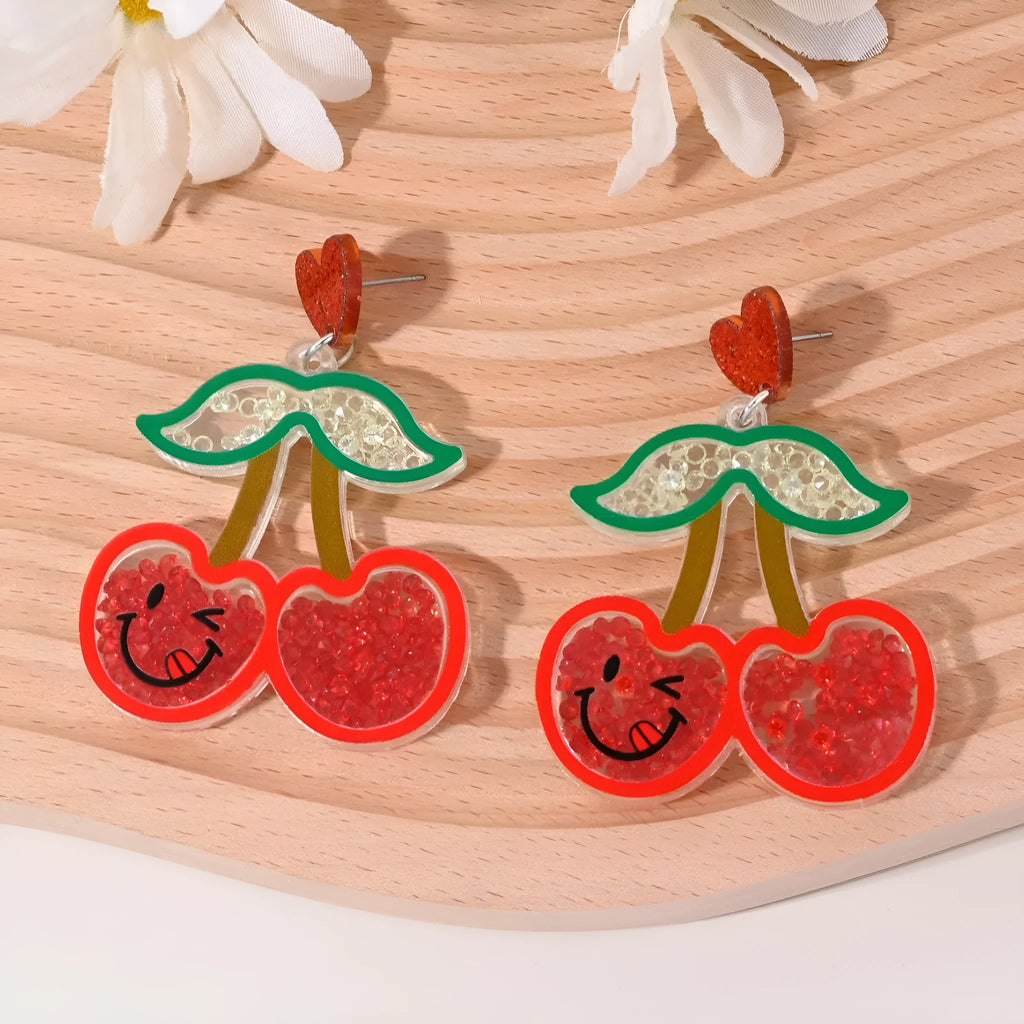 A pair of acrylic earrings shaped like a cherry, strawberry, watermelon, pineapple, coconut cake, or ice cream.