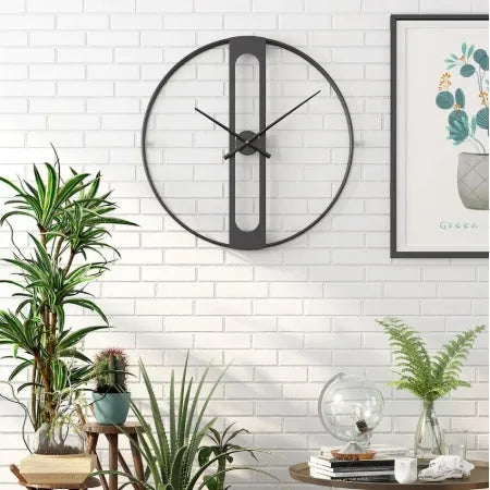 Round metal wall clock with 50cm diameter face in black or gold colour on white wall