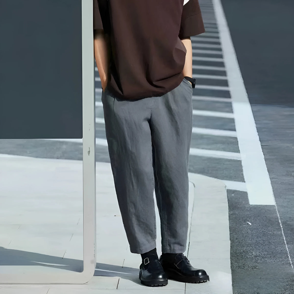 Men's loose straight casual pants with drawstring waist in beige, shown laid flat.