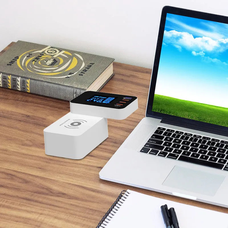 White multi USB port fast charger with built-in 10W wireless charging pad, plug adapters, and cable.