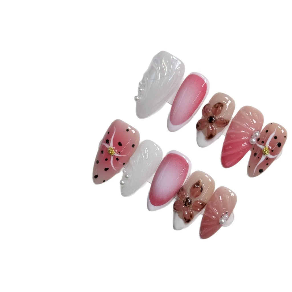 Close-up of hand-painted 3D nail patch with embossed candy pattern on an almond-shaped nail.