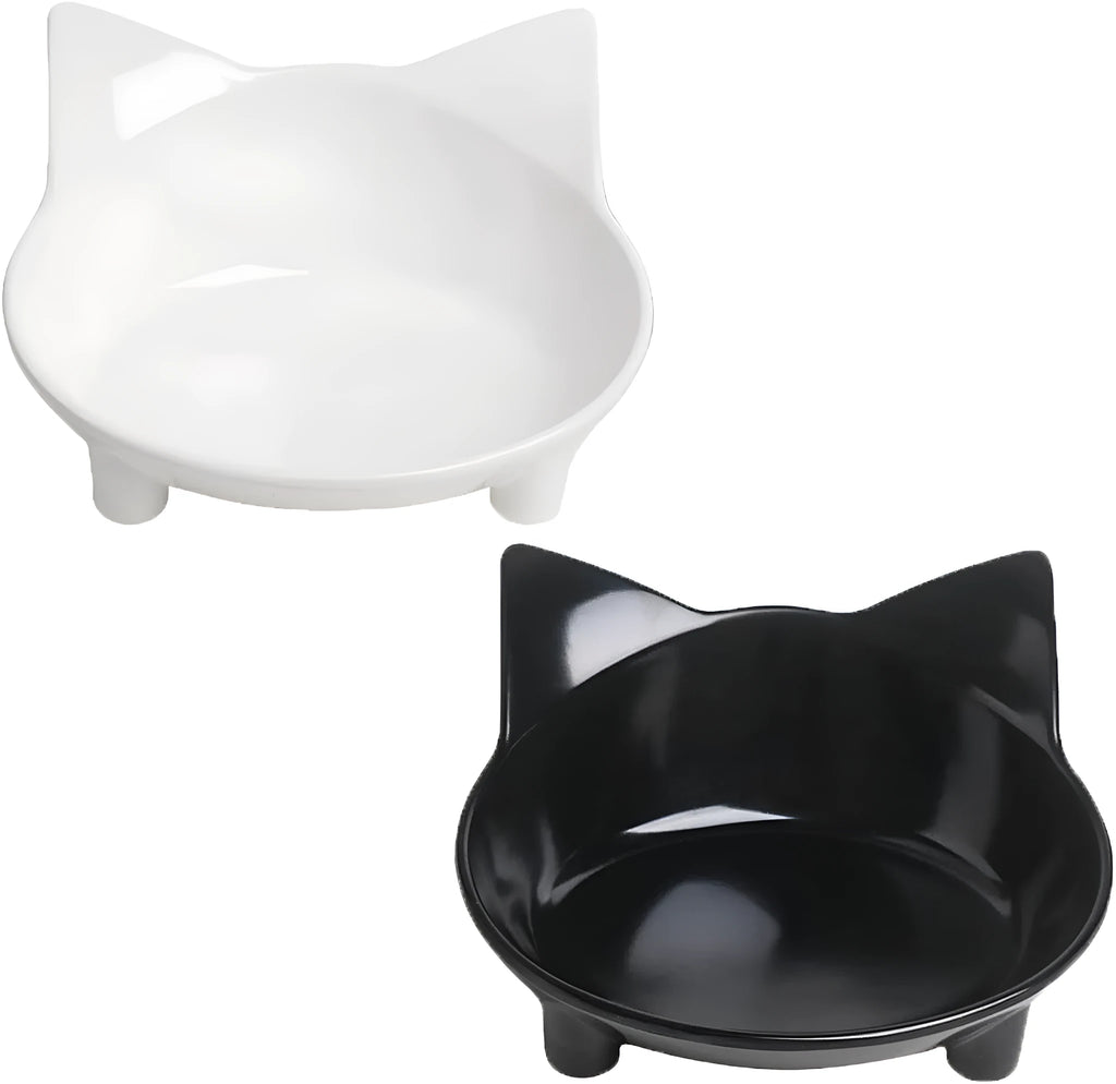 Set of four white shallow melamine pet bowls with black non-slip rubber bases on a table.