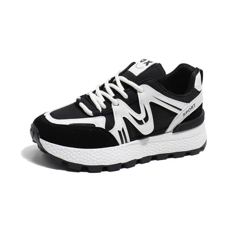 Women's black platform casual sports shoes with flat heel and white lace-up front closure on a neutral background.