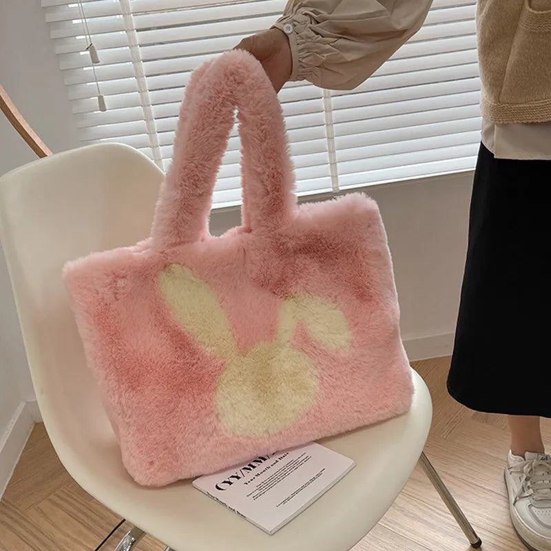 Plush shoulder bag with cartoon rabbit ears in solid colour with shoulder strap