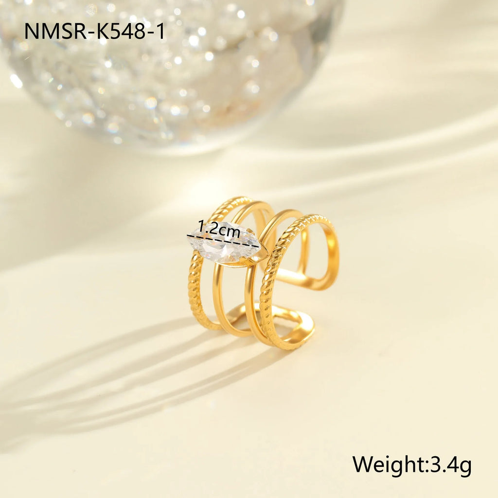 Open mouth stainless steel ring with gold plating and zircon geometric detailing