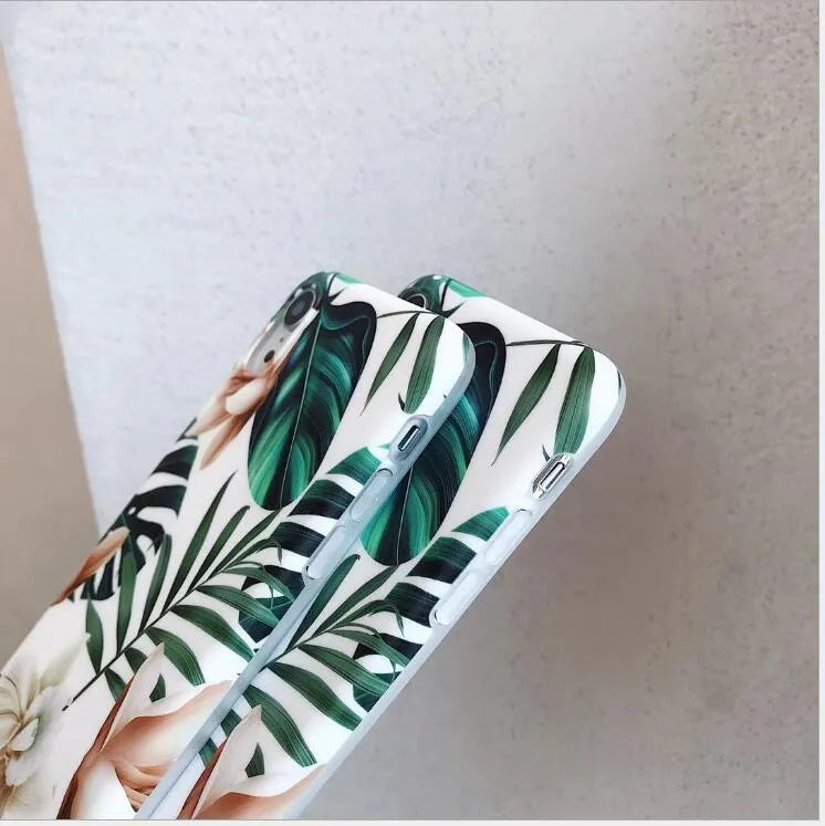 Floral banana leaf design on a flexible TPU phone case for compatible iPhone models.