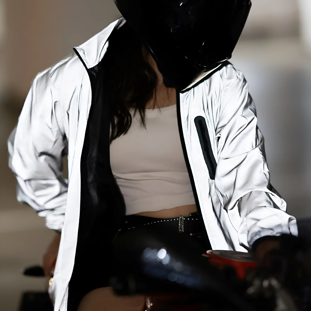 Silver waterproof polyester long sleeved jacket with front zip, shown on a hanger.
