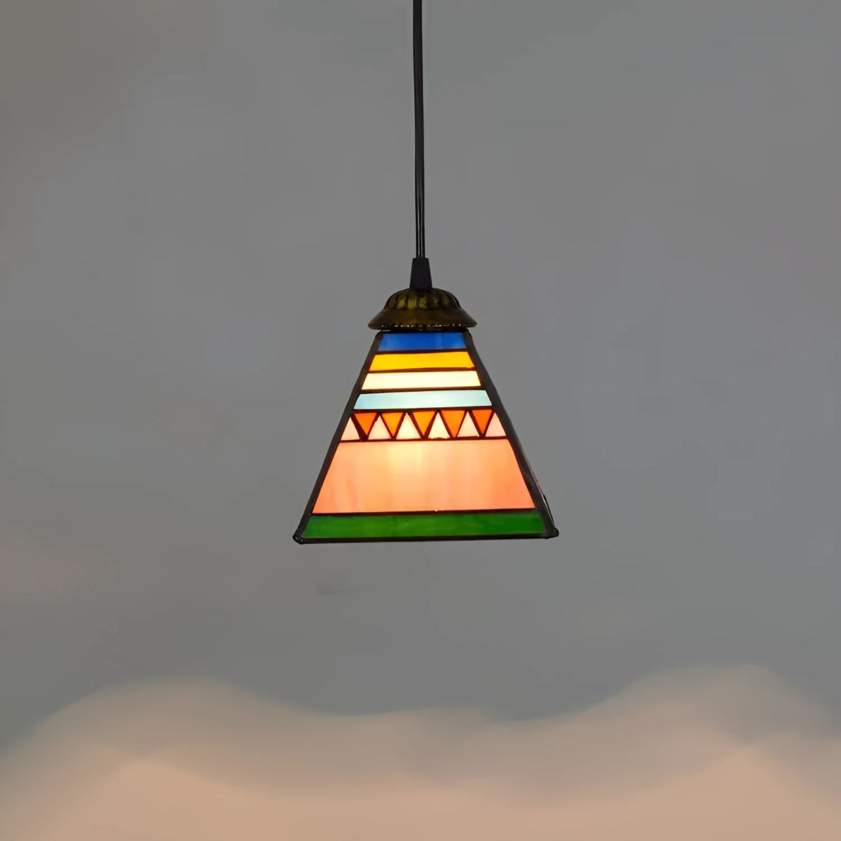 Small stained glass droplight pendant with coloured shade and iron ceiling plate