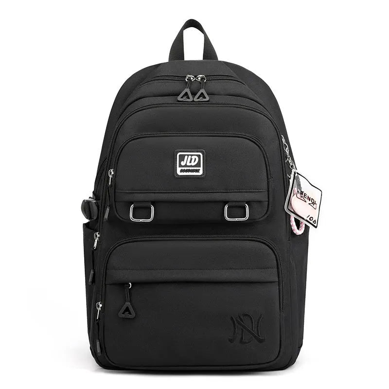 Girls large purple nylon school backpack with anti-theft features and ergonomic back support.
