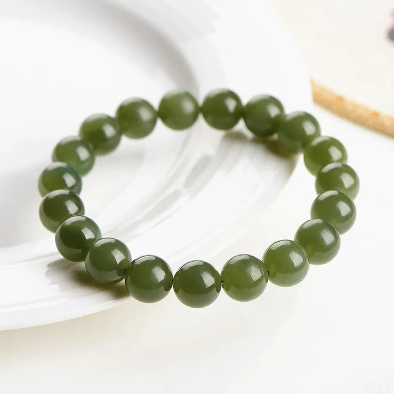 Polished Hetian jade ball bracelet showing spherical beads on a string.