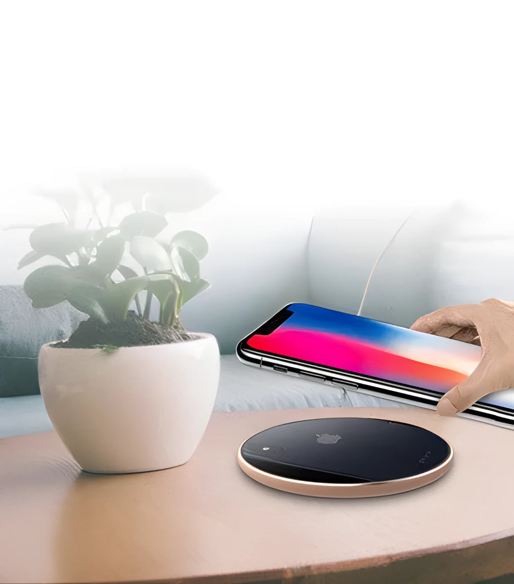 Ultra-thin aluminium wireless charging pad in metallic finish with smartphone charging on surface