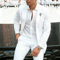 Men's white slim-fit two-piece suit on a hanger, suitable for weddings and business.