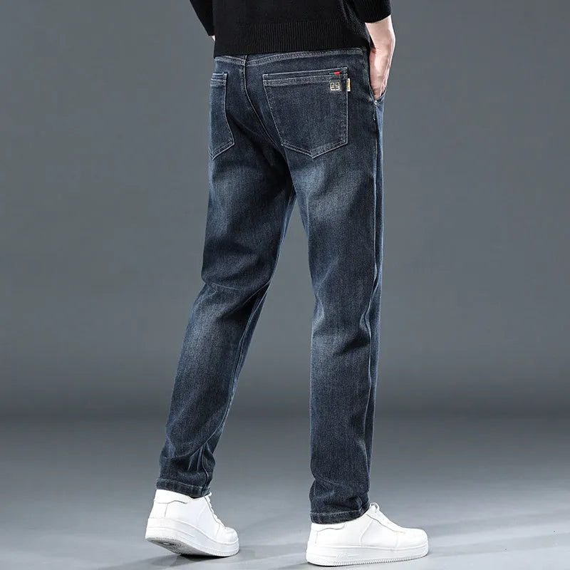 Men's slim straight casual trousers in blue grey, showing loose fit and street fashion style.