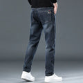 Men's slim straight casual trousers in blue grey, showing loose fit and street fashion style.