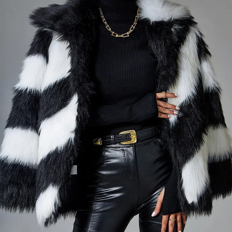 Women's faux fur coat with dark contrast lapels and a light fur collar.