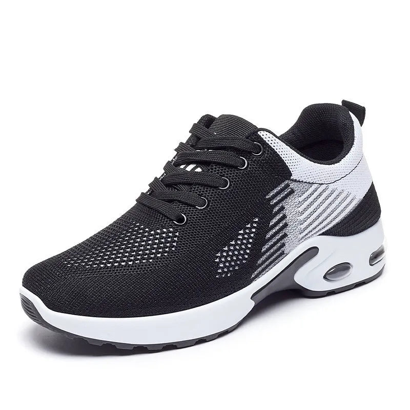 Women's pink Flyknit running shoes with a striped pattern, flat PVC sole, and lace-up front.