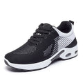 Women's pink Flyknit running shoes with a striped pattern, flat PVC sole, and lace-up front.