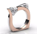 Rose gold geometric alloy couple ring with inlaid zircon stones on a grey background.