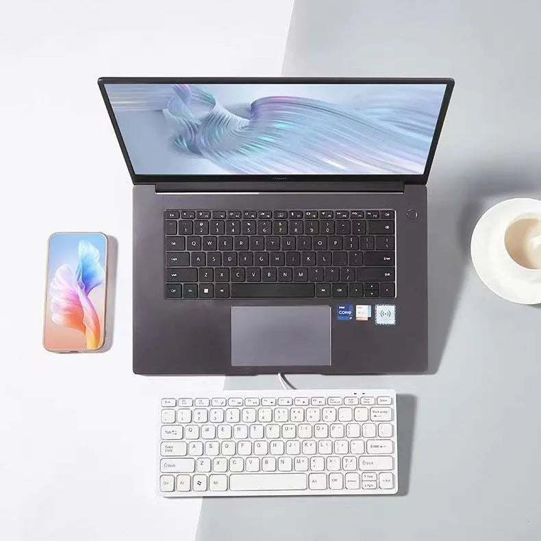 Compact USB wired keyboard in four colour options showing dimensions and quiet key design