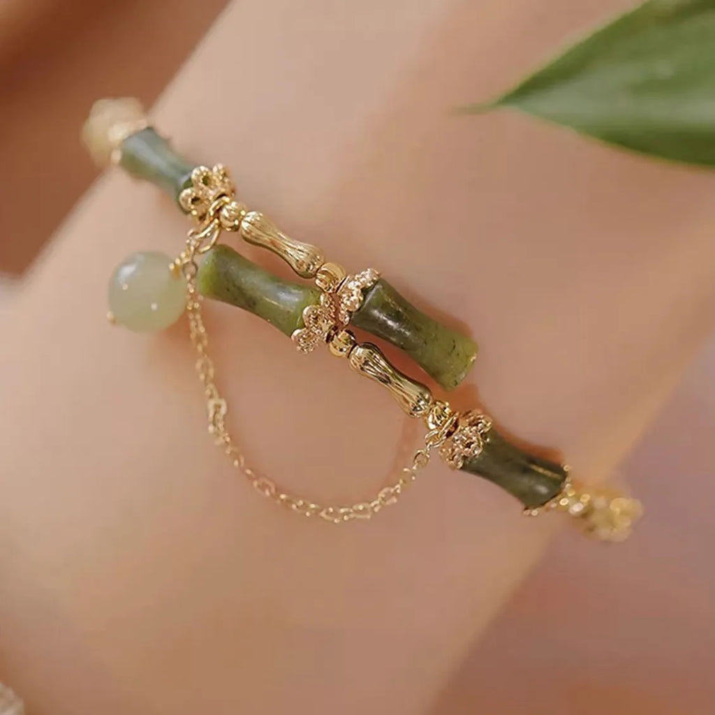 Women's bamboo bead bracelet with coloured glaze beads in plum wine colour showing bamboo joint design