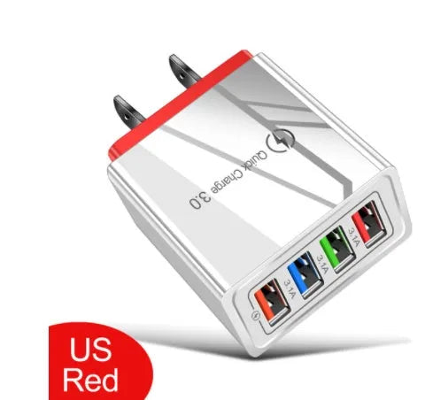 Compact 4-port USB mobile phone charger in multiple colours, shown plugged into a UK wall socket.
