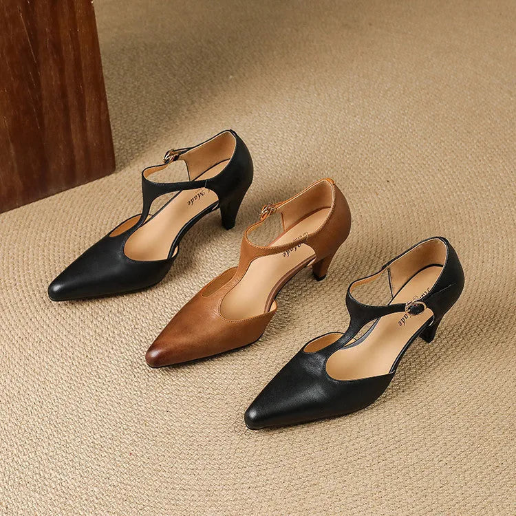 Brown women's retro T-strap sandals with a closed toe, buckle, and a short stout high heel.