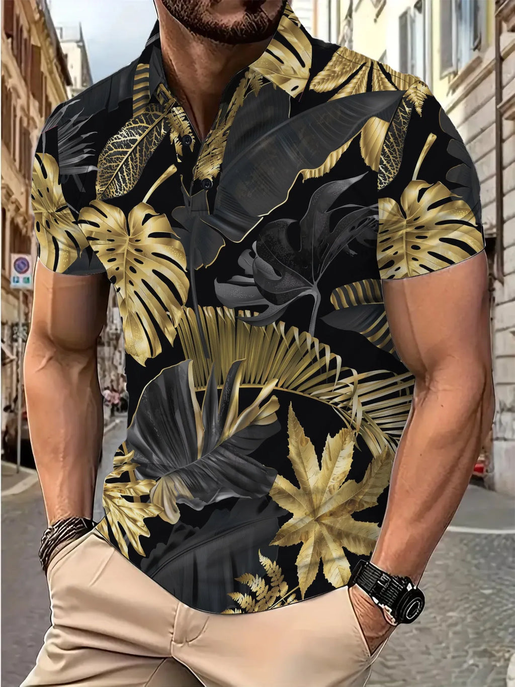 Men's gold short sleeve shirt with a tropical leaf pattern print.