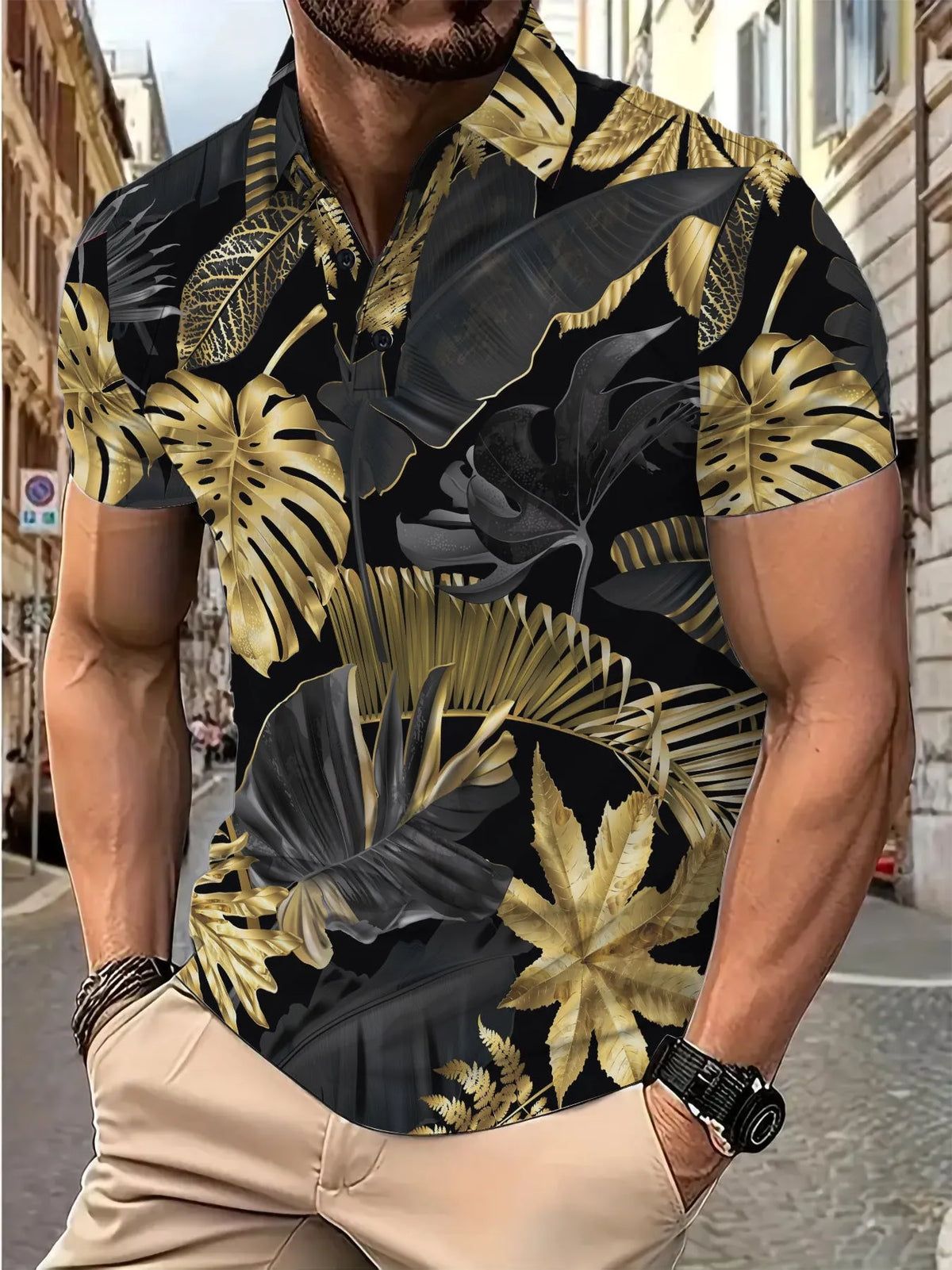 Men's gold short sleeve shirt with a tropical leaf pattern print.