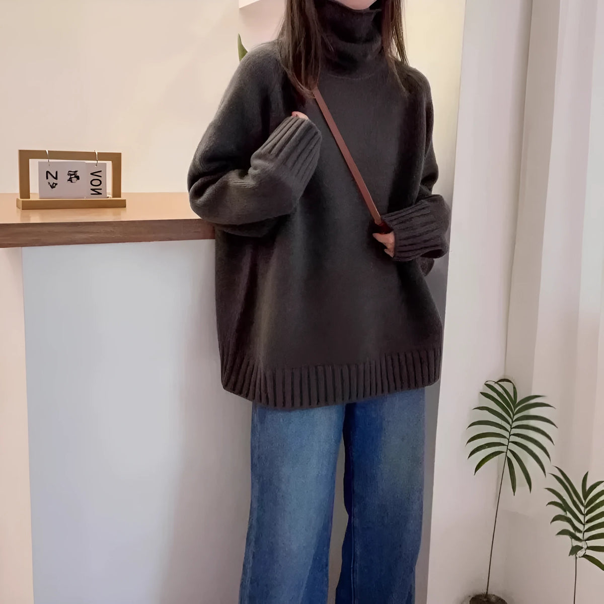 Women's loose fit thick turtleneck sweater with a 3D curling pile collar in red.