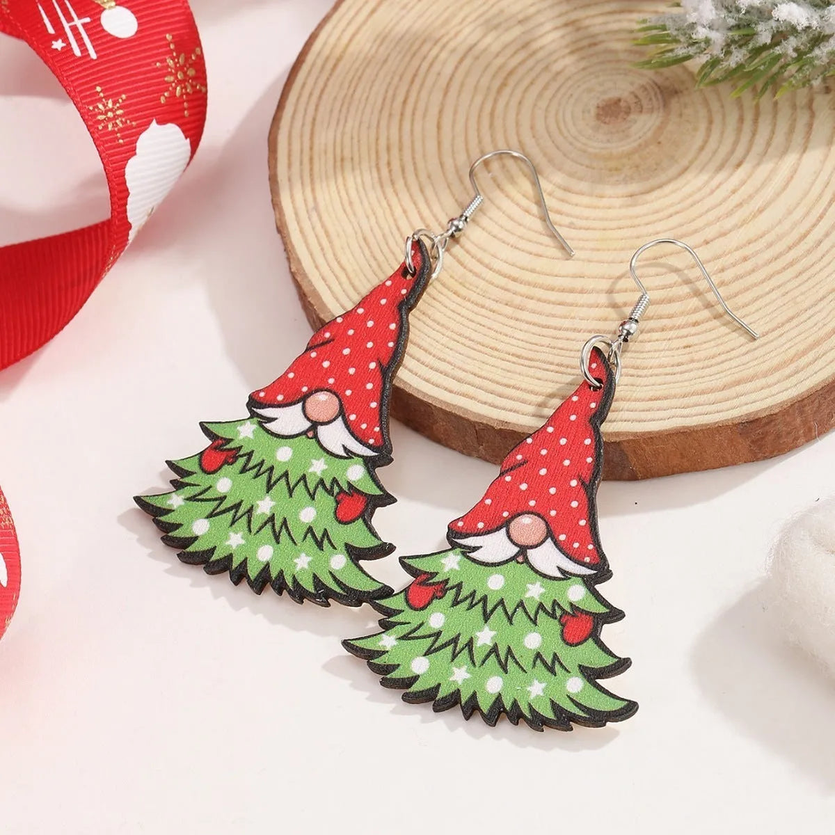 Wooden Christmas earrings with printed geometric Santa Claus designs in Christmas tree and water drop snowman styles