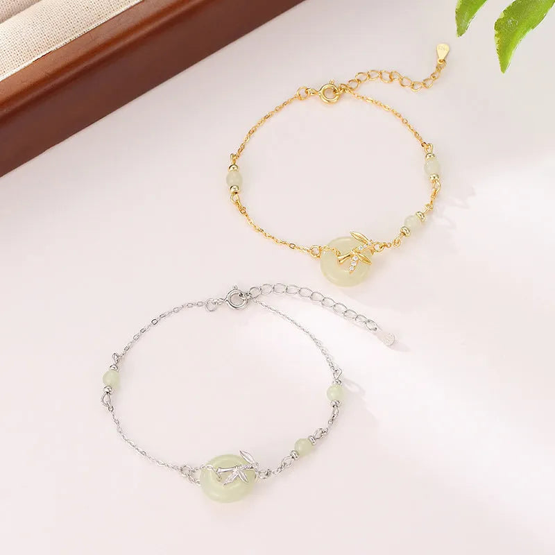 Women's antique-style 925 silver bracelet with Hetian jade and a gold-toned safety buckle clasp.