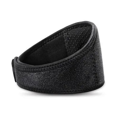 Black self-heating magnetic therapy neck guard with adjustable shoulder strap on a grey background.