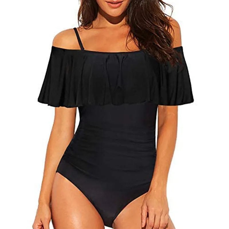 Black one-piece swimsuit with side cut-outs and ruffled shoulder straps on a mannequin