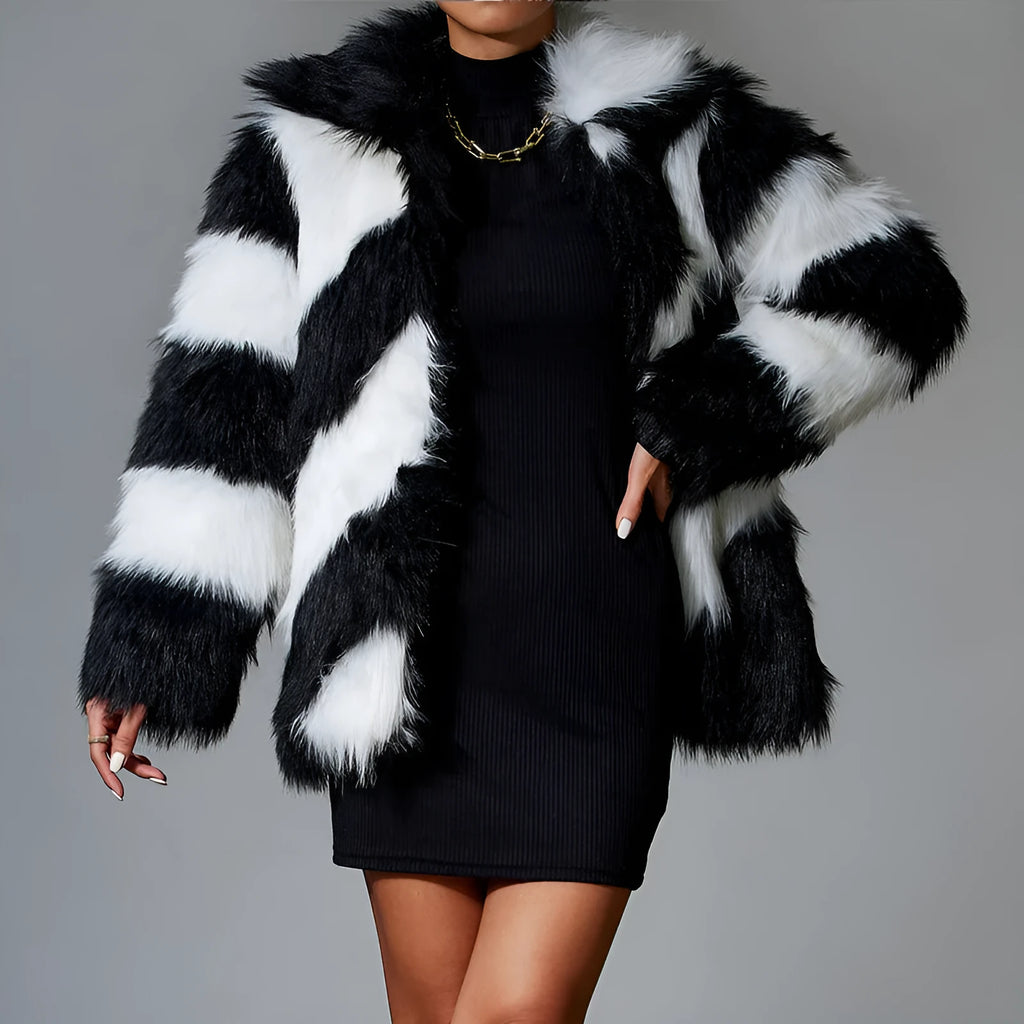 Women's faux fur coat with dark contrast lapels and a light fur collar.